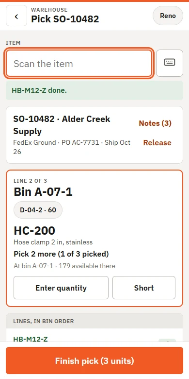 The handheld app partway through picking an order, showing the bin, the part and how many are left to pick